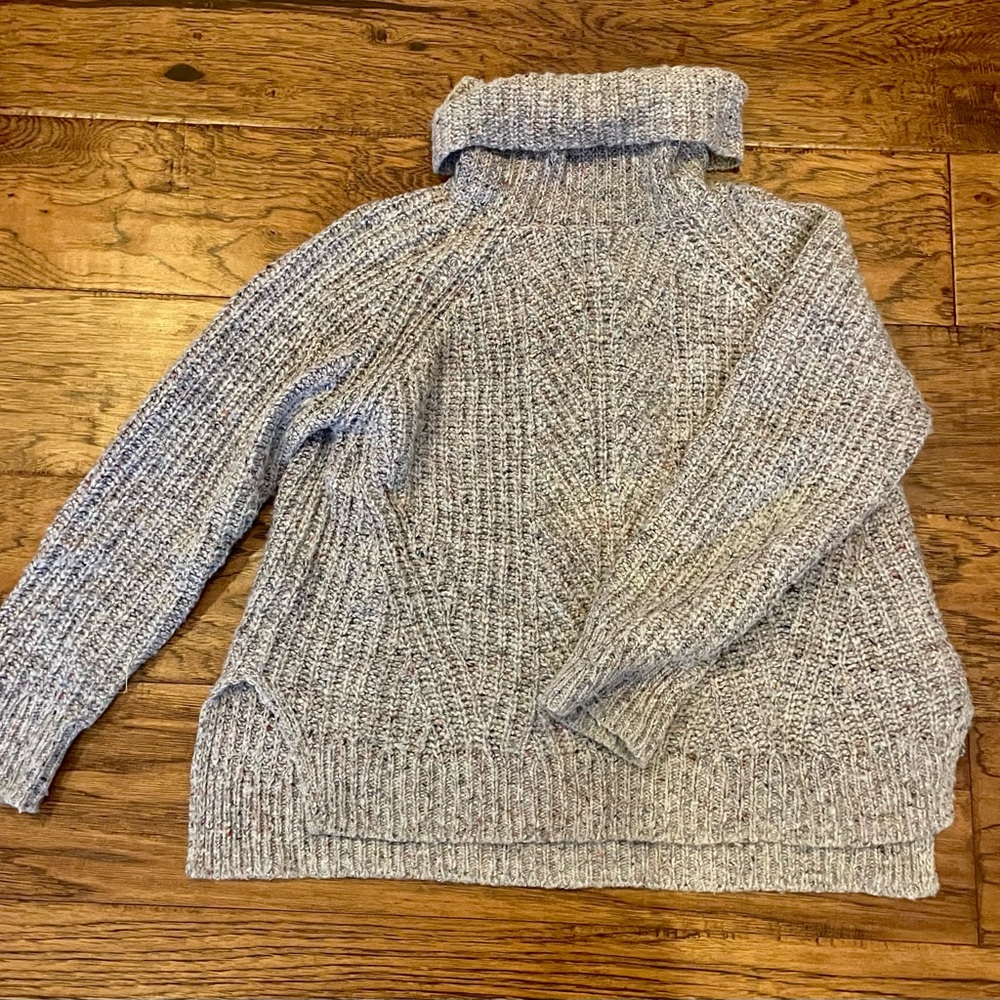 Madewell dark grey turtleneck with colorful string woven in.